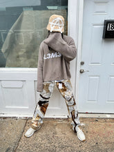 Load image into Gallery viewer, Tan “Floral faces” denim
